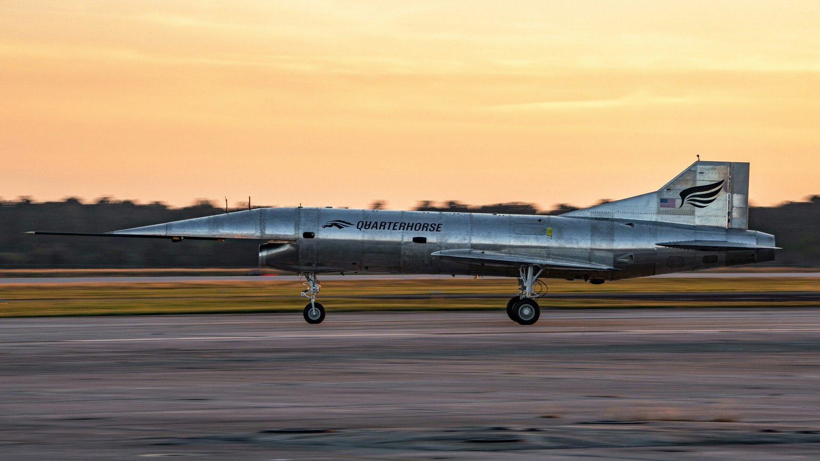 A fighter jet taking off from an airport runway